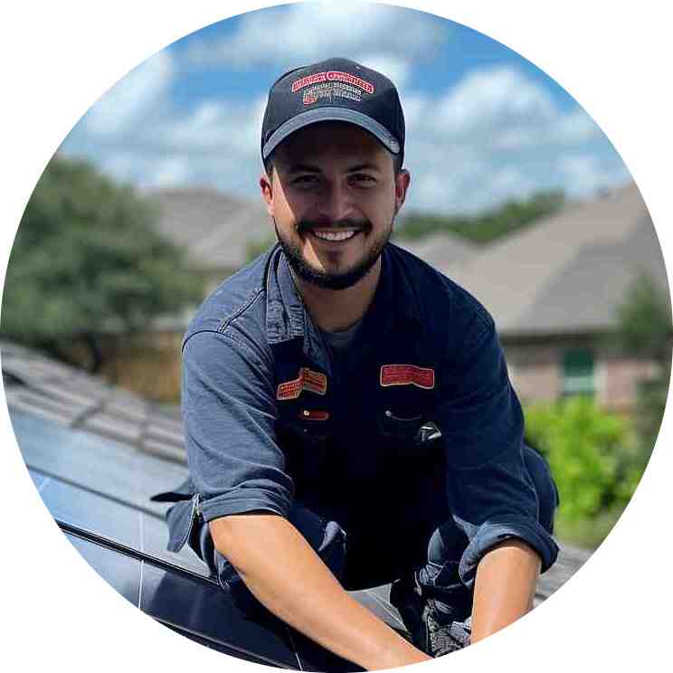 jacob hoang installing solar on a roof and smiling for the camera